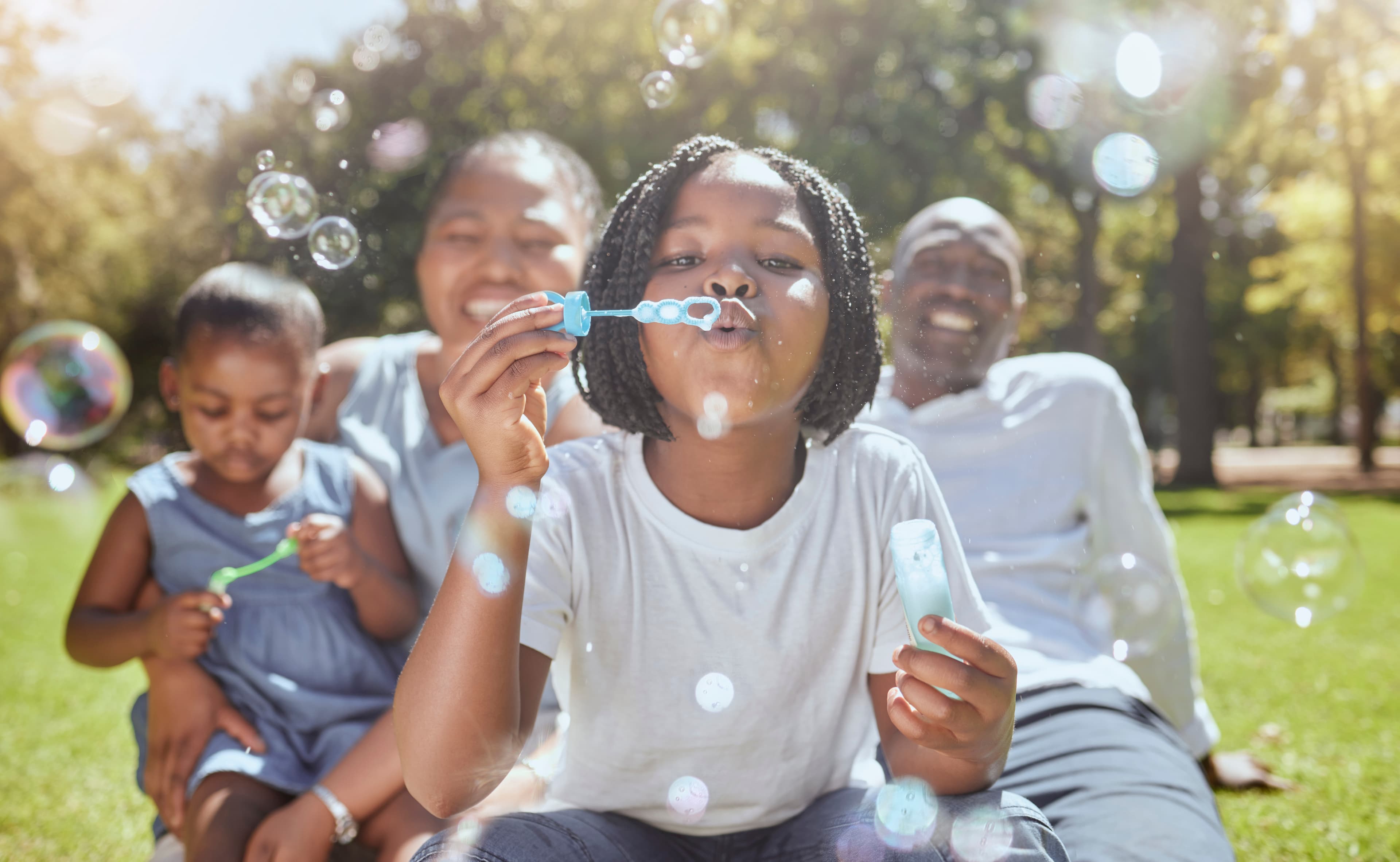 Family blowing bubbles