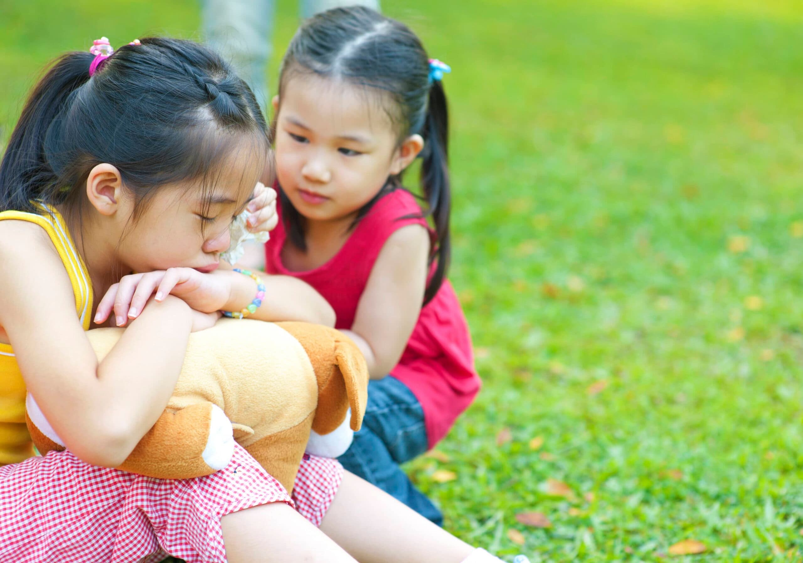 one girl is comforting another girl