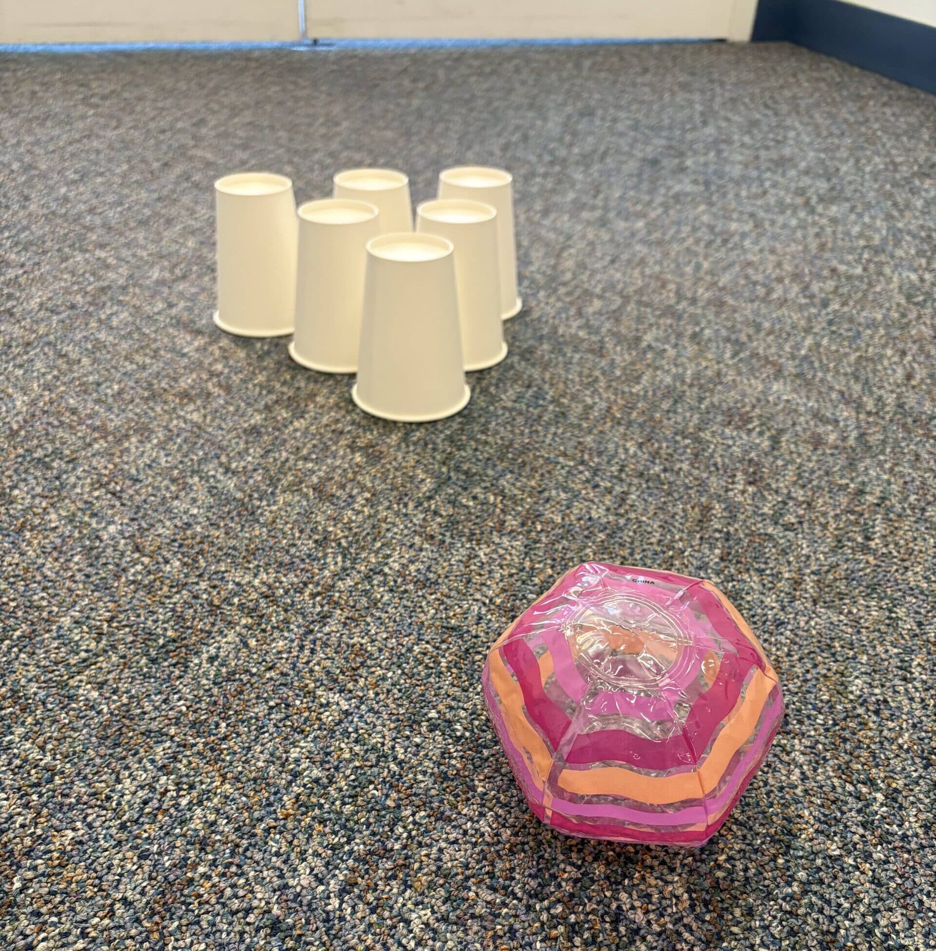 beach ball bowling with paper cups
