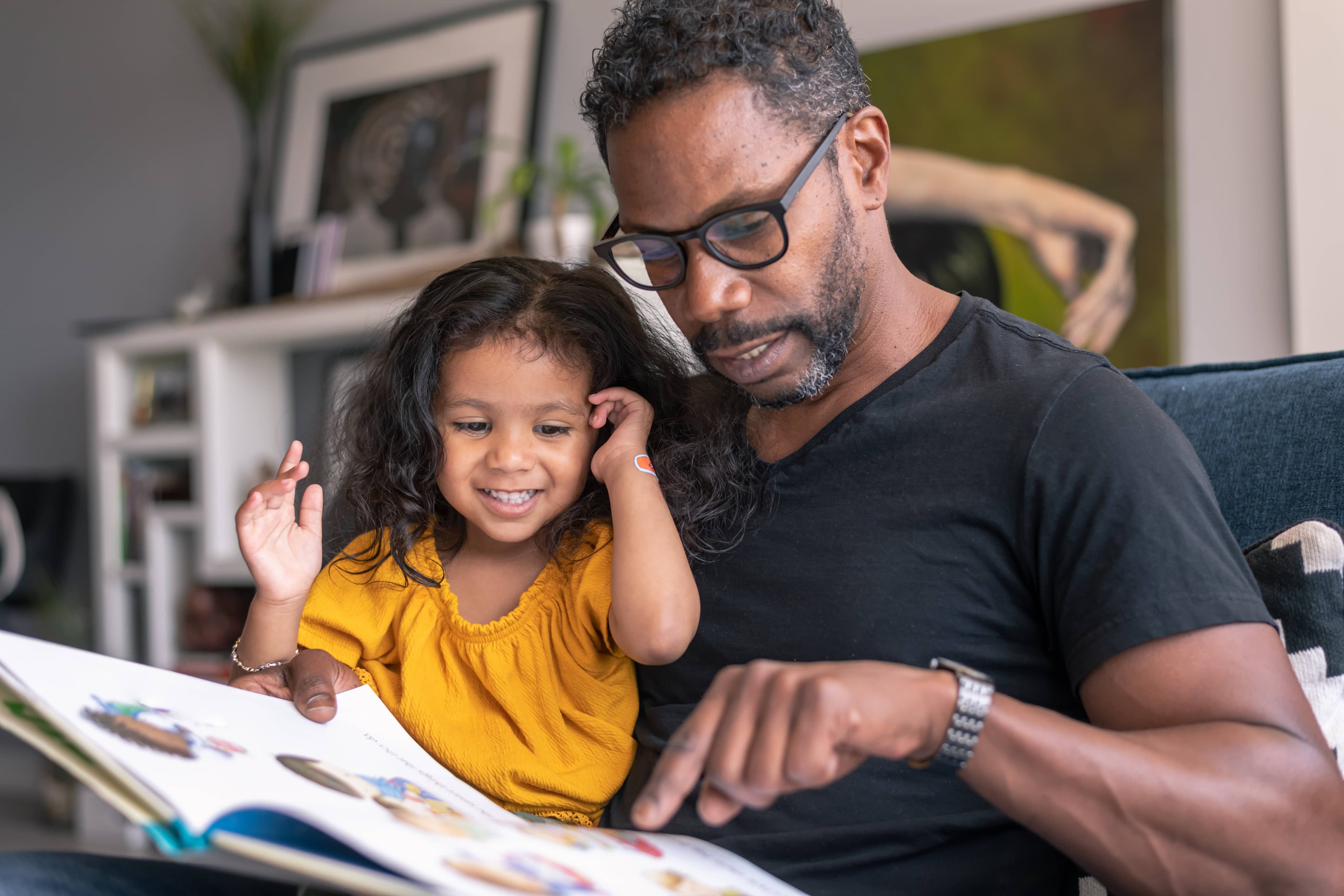 parent and child reading a book