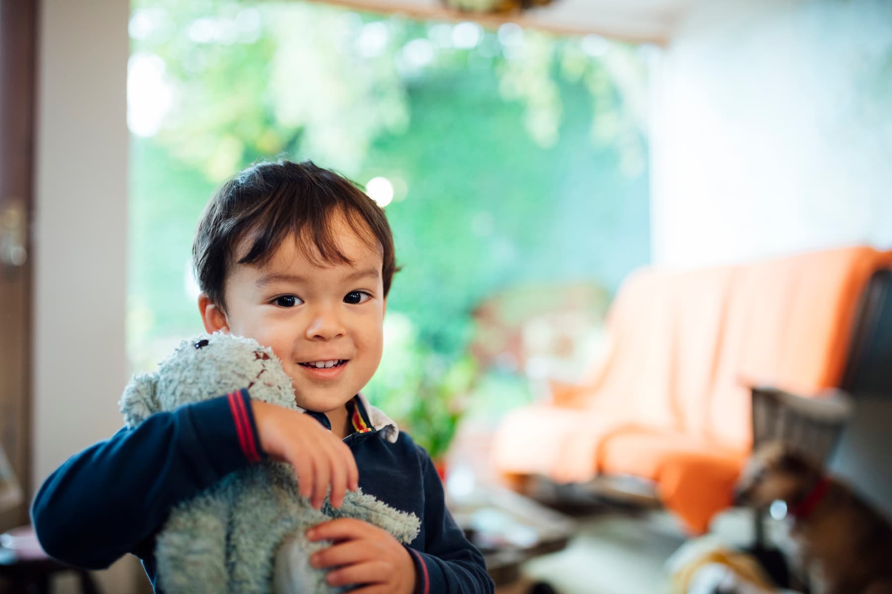 boy hugging his stuffed animal
