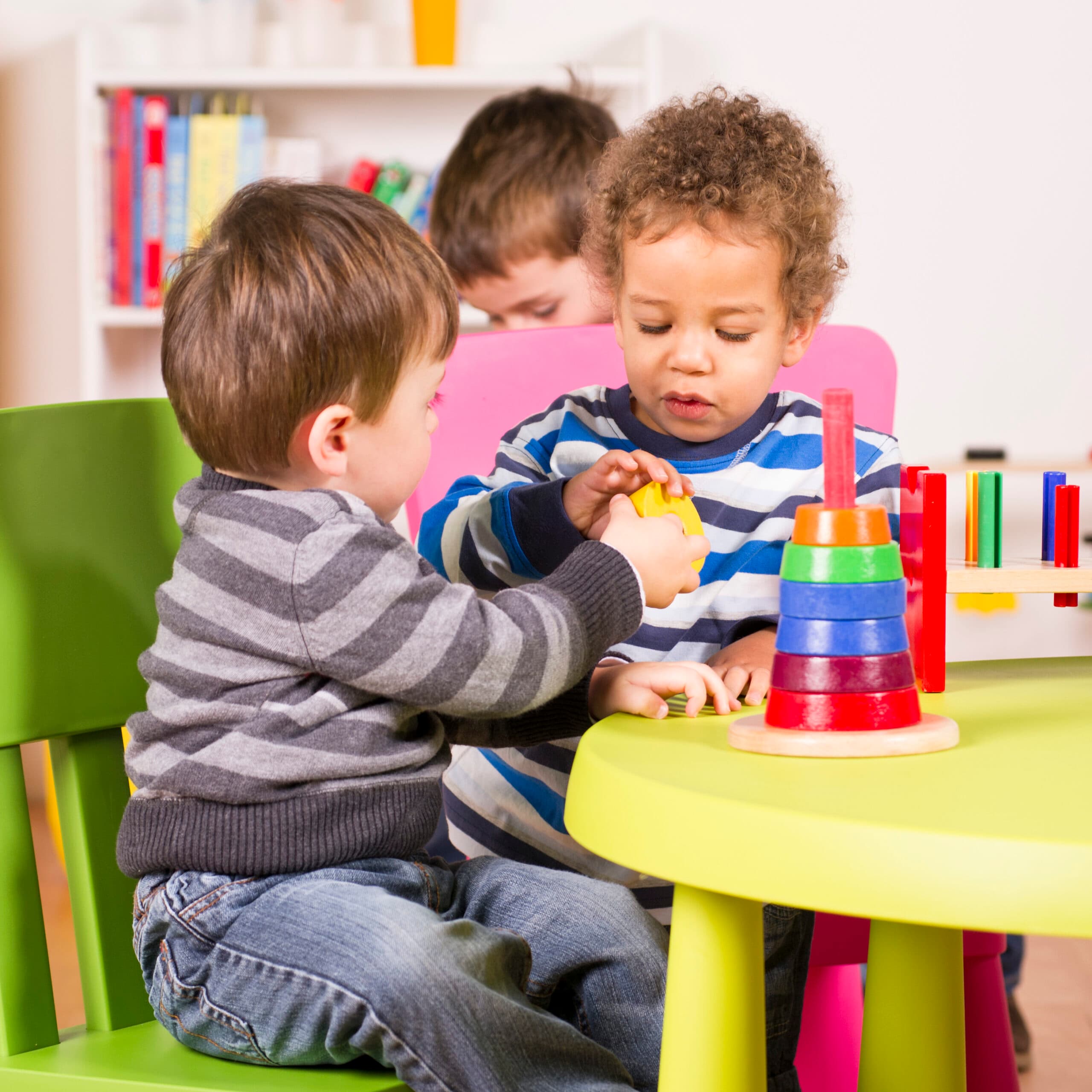 Toddlers helping and sharing