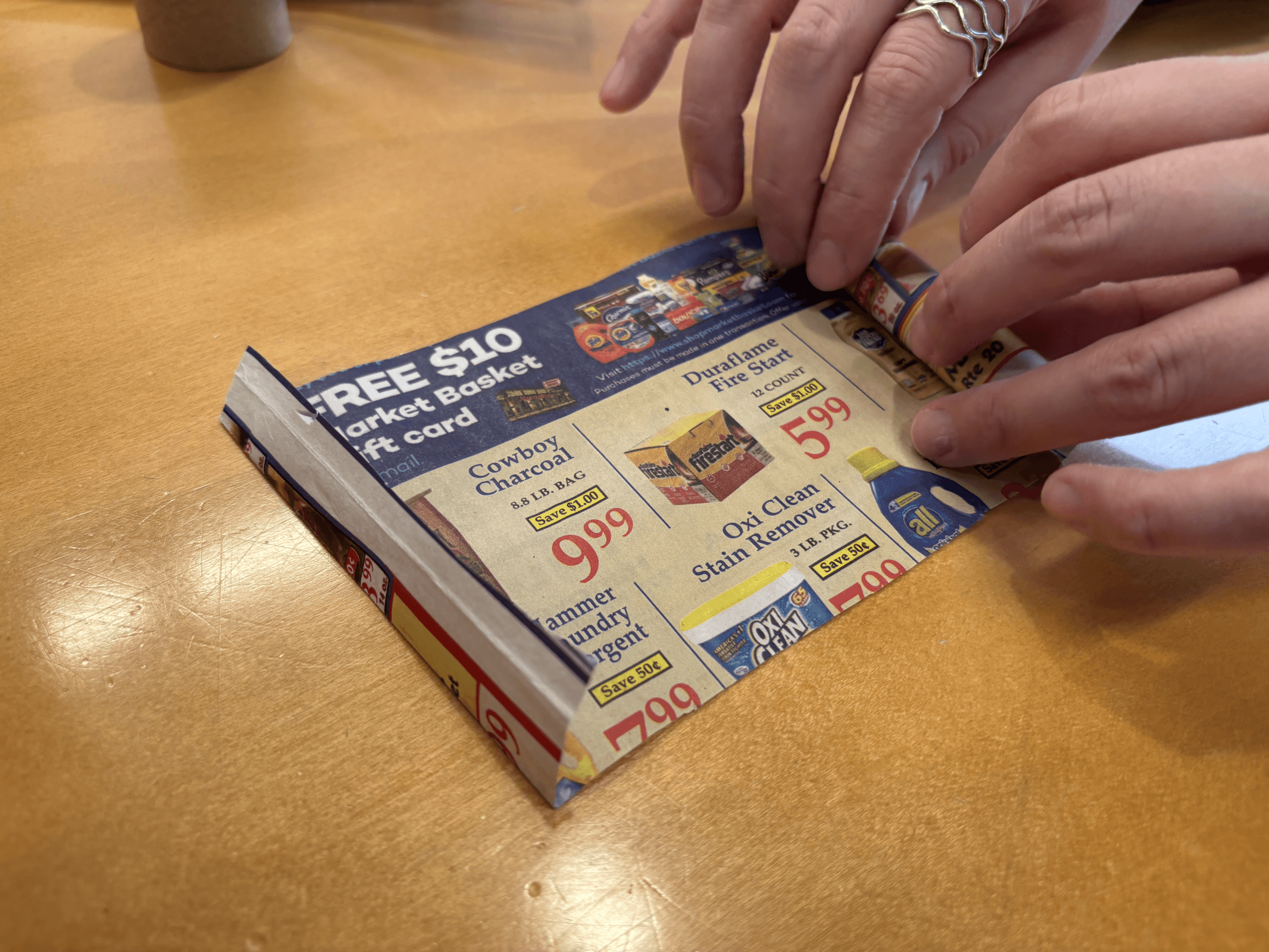 rolling a piece of newspaper